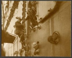 Troops loading transports. Several 15th Battalion personnel
visible in porthole. Quebec 1914.