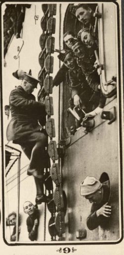 Troops loading transports. Several 15th Battalion personnel visible in porthole. Quebec 1914.