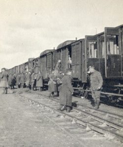Entraining
in Nazaire, France Capt Duguid front drinking tea.