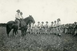 LtCol JA Currie and Capt RC Darling mounted with Officers assembled in
front of troops at Petawawa camp June 1914.