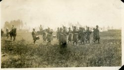Pipes and Drums with LtCol Currie and Capt Darling mounted following
behind. Petawawa camp 1914.