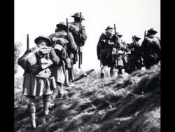 “Moving up” Amiens 1918. Identity of the troops is in question. Kilts are not clearly visible and as the image is not in colour, the shoulder patch with triangle over the rectangle could be the 15TH or 2nd Bns as both were kilted and both were the third infantry battalion in their respective brigades. Various publications have labelled the photo as 42nd.