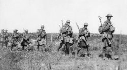 “Carrying party.” Amiens 1918. Identity of the troops is
in question. Kilts are not clearly visible and as the
image is not in colour, the shoulder patch with triangle over the rectangle
could be the 15TH or 42nd
Bns as both were kilted and both were the third infantry battalion in their
respective brigades.
Various publications have labelled the photo as 42nd.