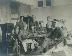 Canadian officers posing wearing Russian uniform items. L-R: Capt Alexander, Lt MacLean, Maj Osborne, Capt Scudamore?, Capt Cory, Capt Streight?, Capt Johnston?, Lt Barwick, Lt ?.Bischofswerda POW camp, Hannover, Germany. Undated.