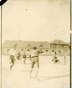 Lts MacLean and Fessenden playing tennis. Bischofswerda POW camp, Hannover, Germany. Undated.