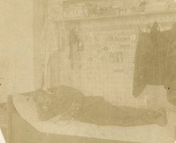Capt Cory lying on bunk in barracks. Bischofswerda POW camp, Hannover, Germany. Undated.