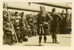 Kilted dancer entertaining mixed group of 15th Bn and other troops on board RMS Baltic 1919. Transporting the 15th Bn from the UK to Canada.
