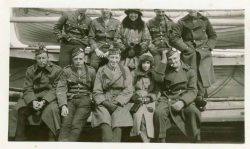 On board either the SS Lapland to the UK or the RMS Baltic to Canada 1919. 2nd from left front row Lt G Malone. Left to right with heads cut off in back row are Alex, Capt E Haldenby, Beaver Reid.