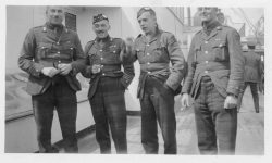 L to right: Capt Mike Turnbull; Maj Maybin; Lt G Malone and unidentified. Canada 1919 onboard RMS Baltic.