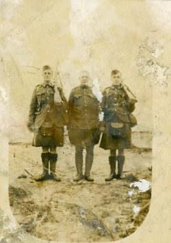 Prisoner and escort.
Privates with Ross and Oliver webbing. Home Battalion Canadian Defence Force 1917