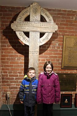 The great grandchildren of Private Edwin Keen KIA at Vimy
in April 1917 visit the Vimy cross which bears his
name at the Regimental museum in Toronto.