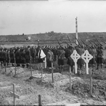 15th Battalion firing party firing a volley over the grave of Lt E Ryrie July 1917.